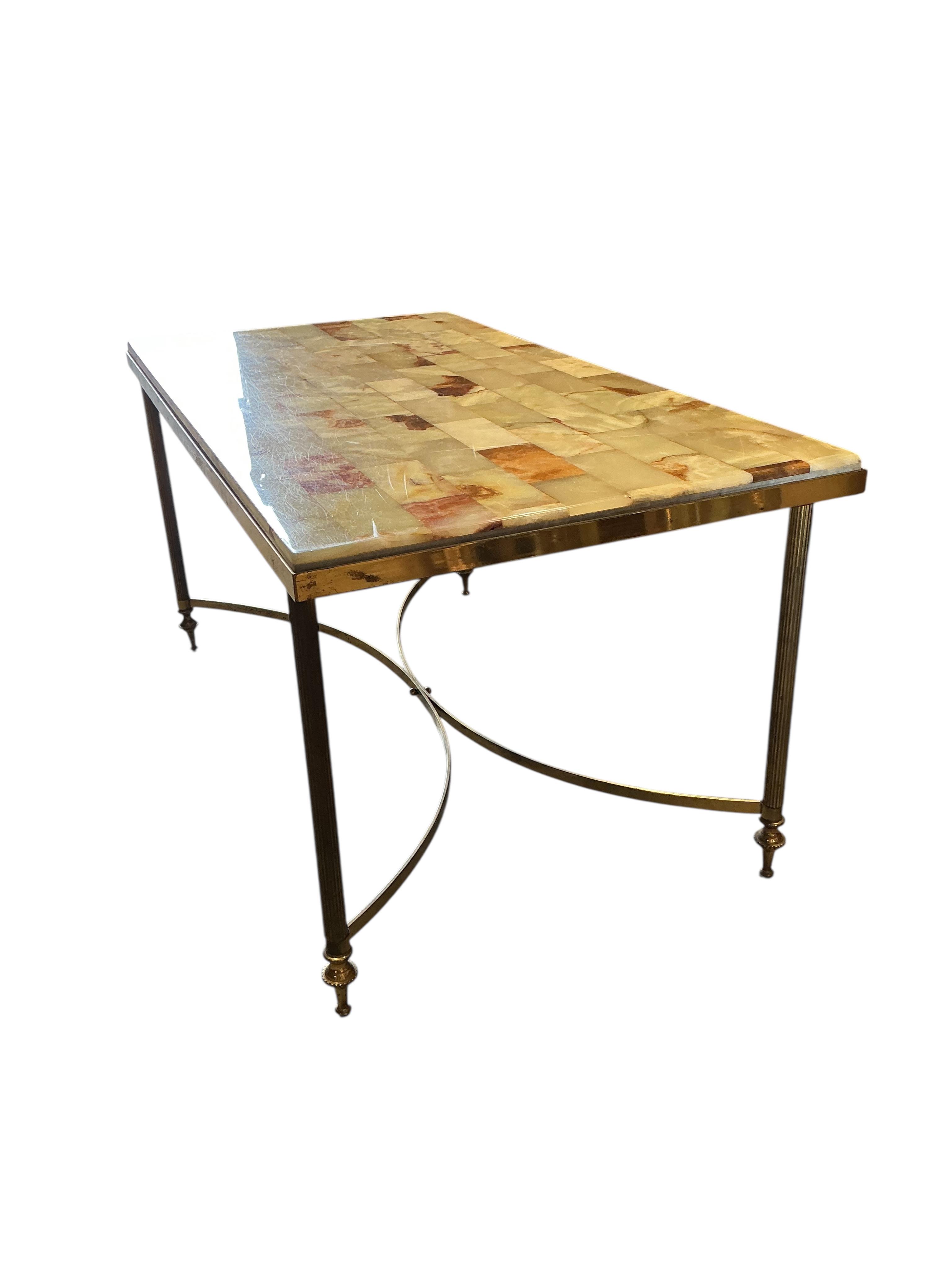 A rectangular brass and onyx coffee table, width 87cm, depth 46cm, height 42cm